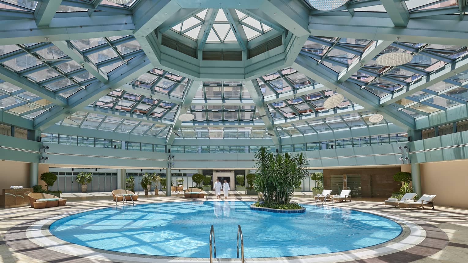 Skylights pour in natural light over the indoor pool at four seasons hotel alexandria 