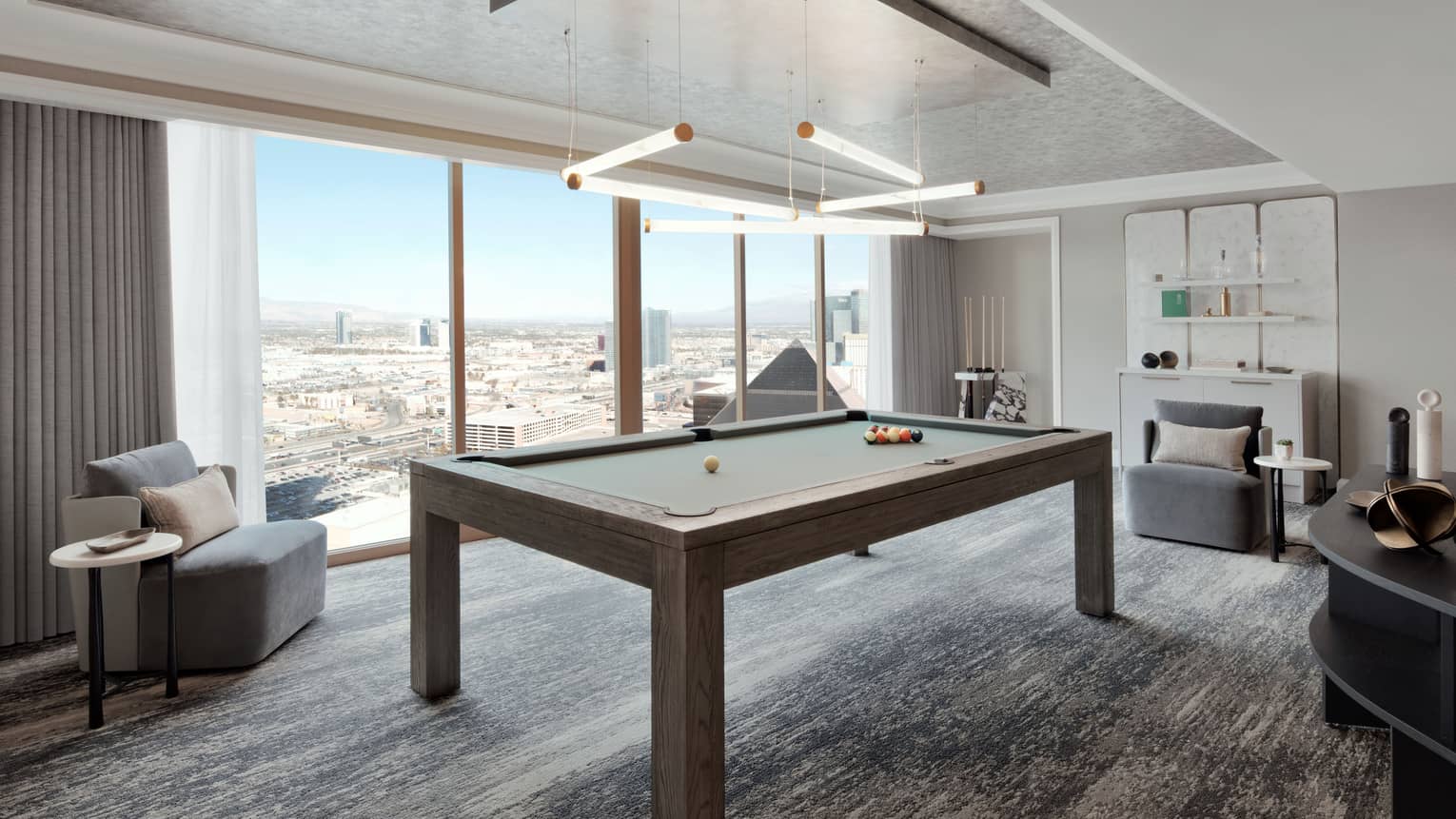 Media room with billiard table and wall of windows with Las Vegas view, Penthouse Suite at Four Seasons Hotel Las Vegas