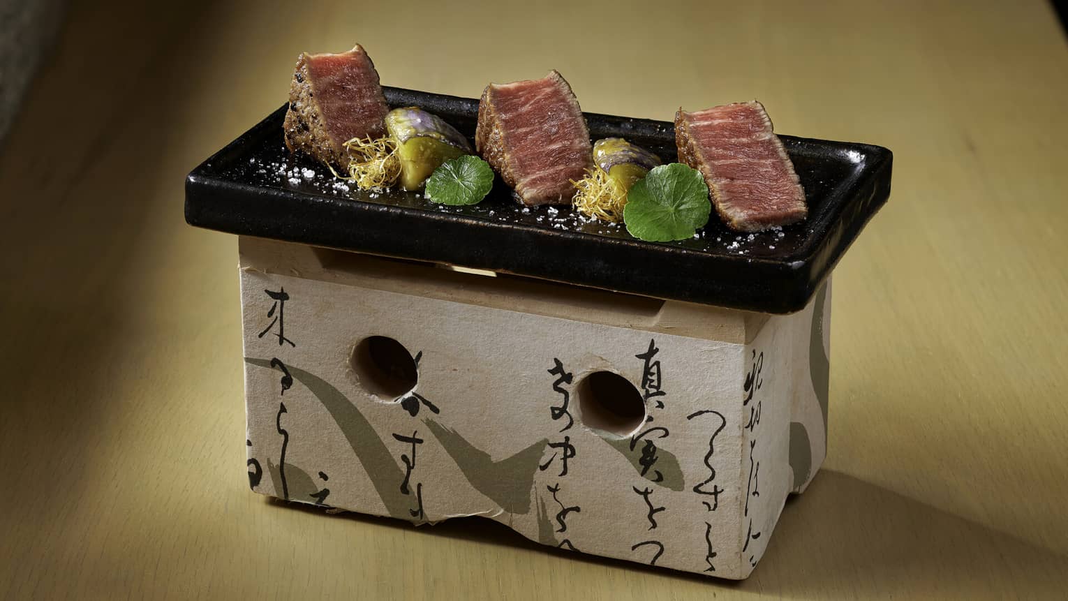 Cubes of rare A5 beef on Japanese stone