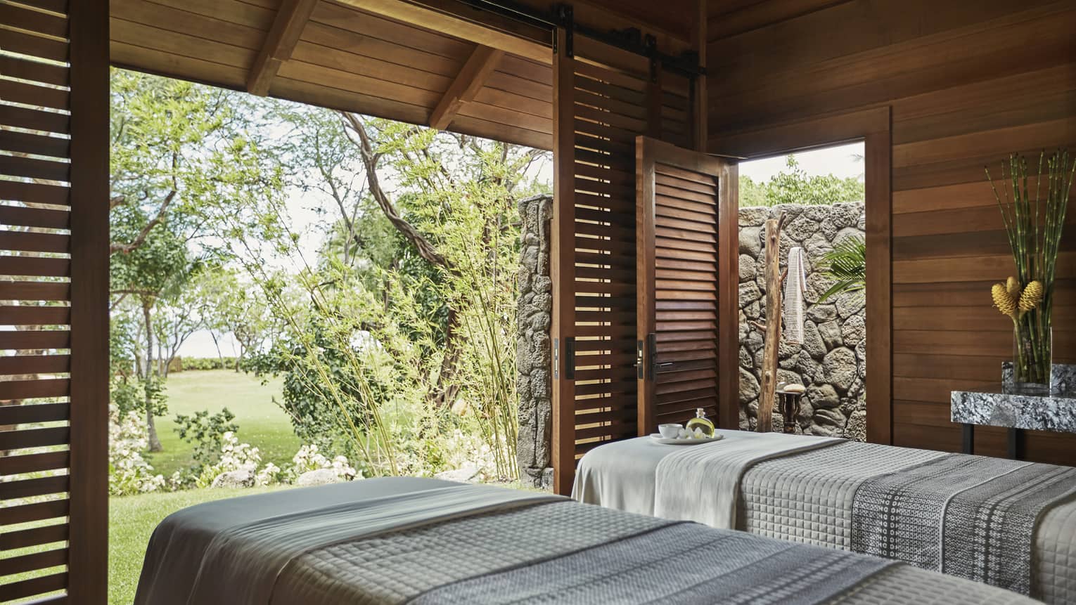 Spa Hale Couples Room side-by-side in pavillions with open sliding wood shutters