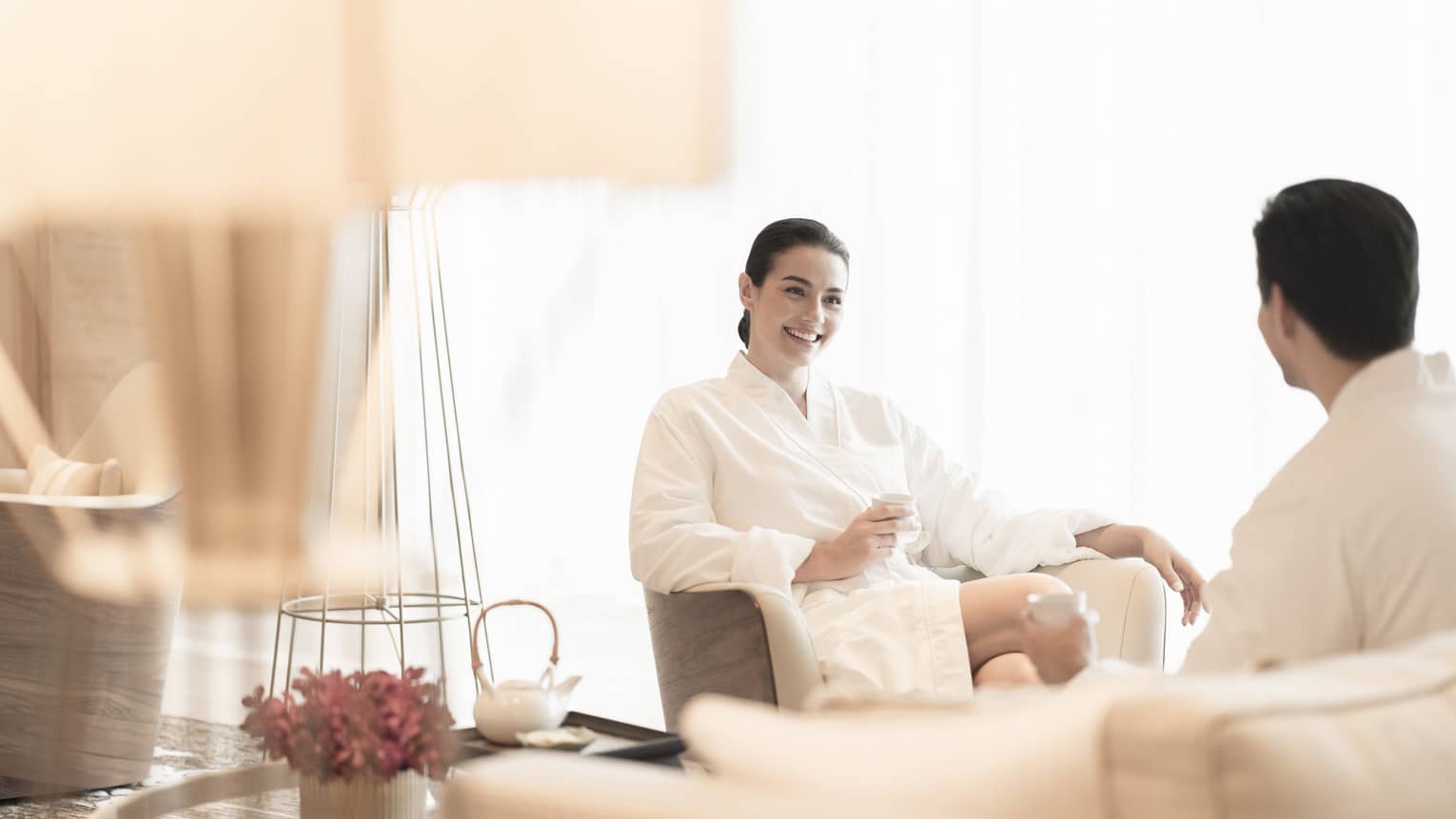 A couple relaxes in the spa seating area