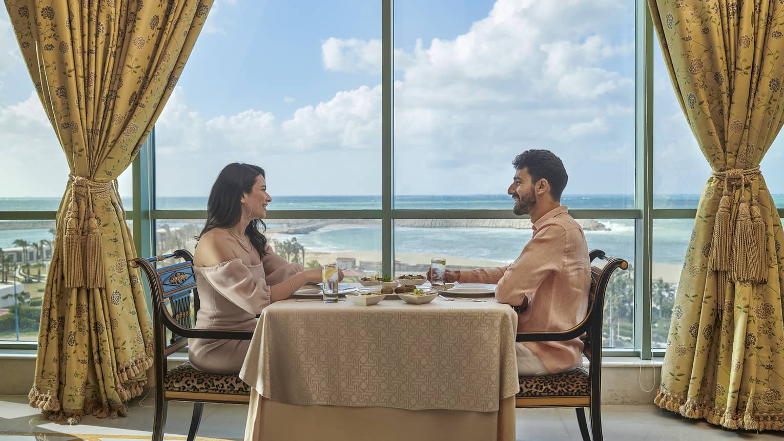 Couple enjoys a meal at Byblos Restaurant with views of the Mediterranean Sea