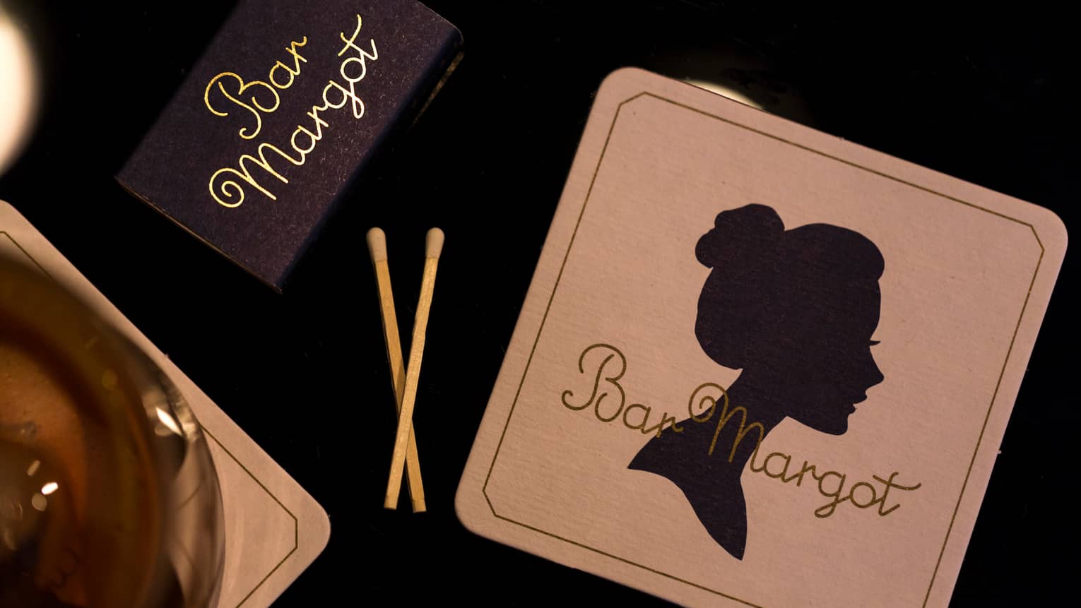 Bar Margot matchbox, two matches and coaster with vintage silhouette of woman's face