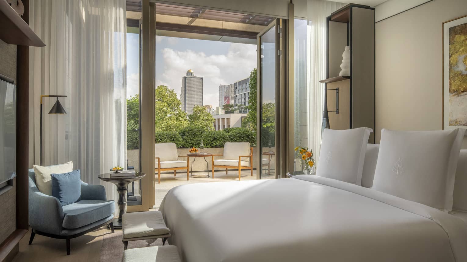 Hotel suite bedroom with terrace at Four Seasons Hotel Bangkok