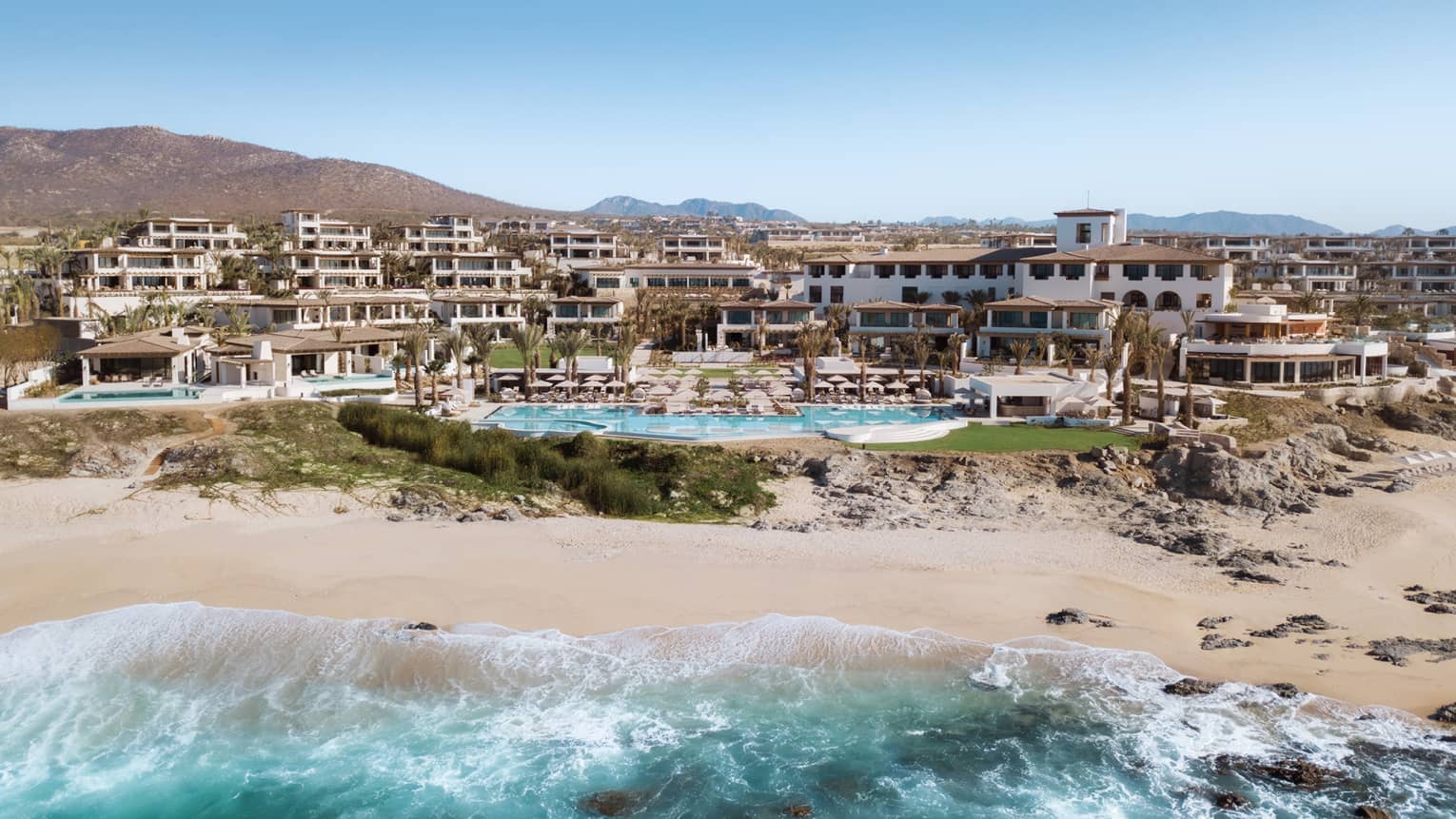 Aerial view of Four Seasons Resort and Residences Cabo San Lucas with beach