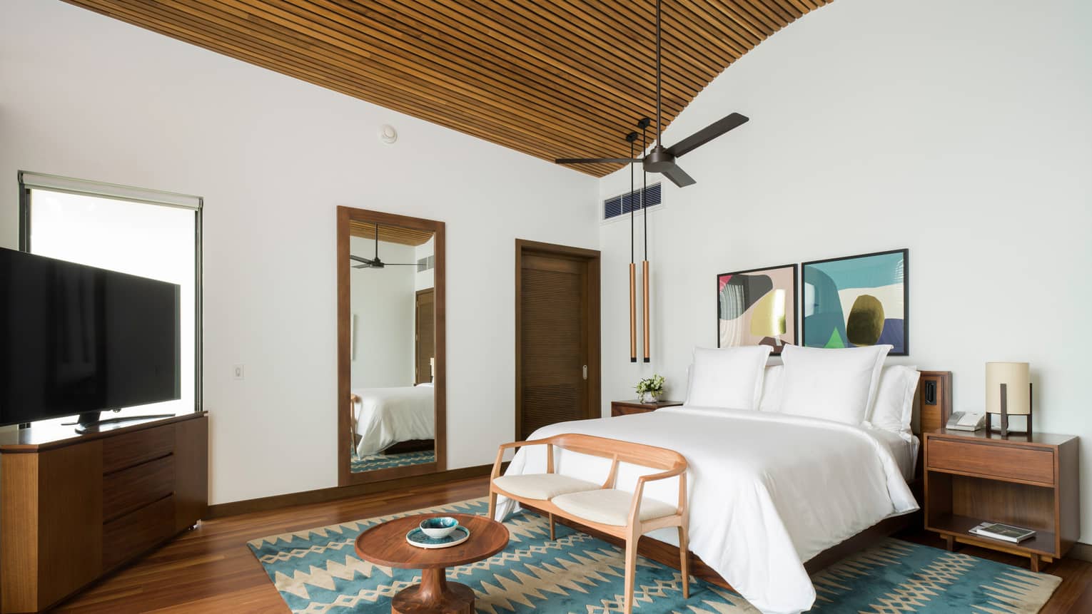 Bedroom with king bed, wooden ceiling, ceiling fan