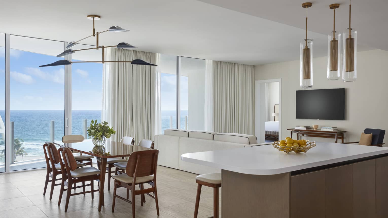 Kitchen island and dining table with ocean view