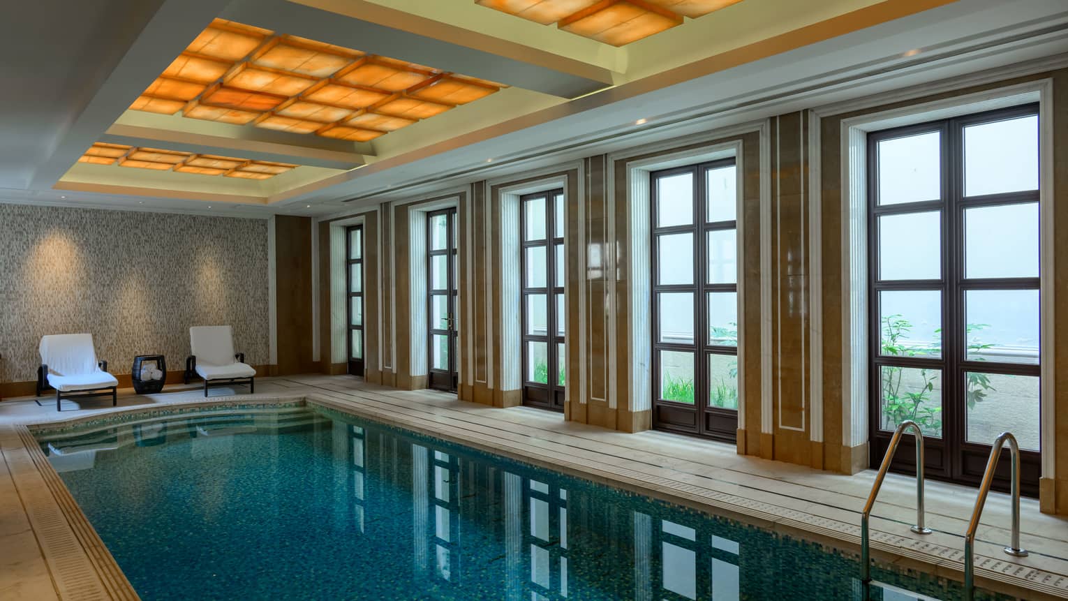 Private indoor pool room with french doors, luxury villa at Four Seasons Hotel Hangzhou at West Lake