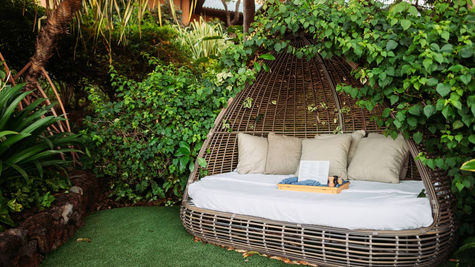 Covered daybed in garden setting