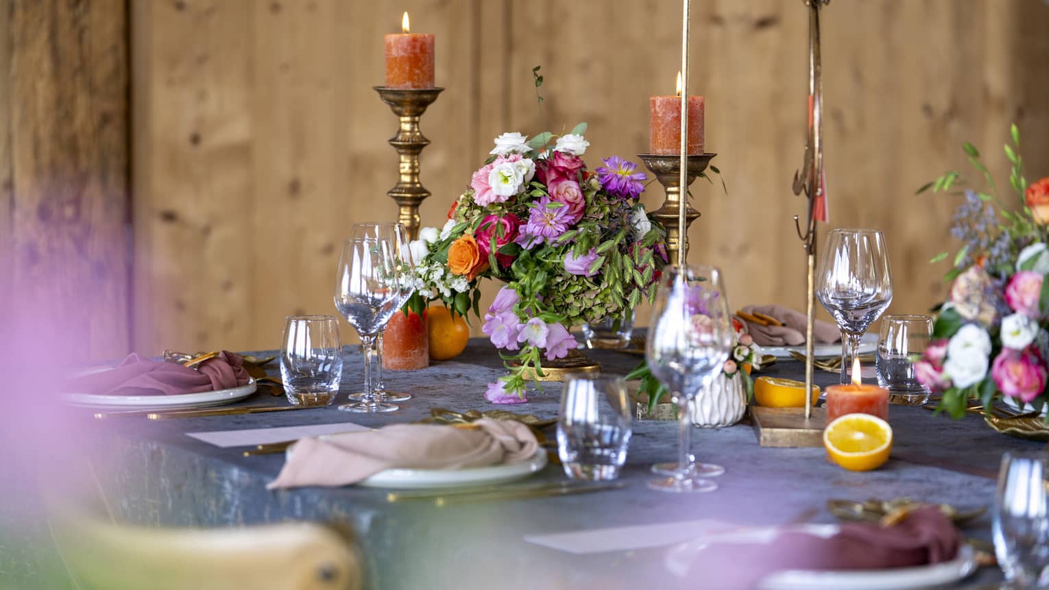 Wedding table setting with assorted flowers and burnished accents