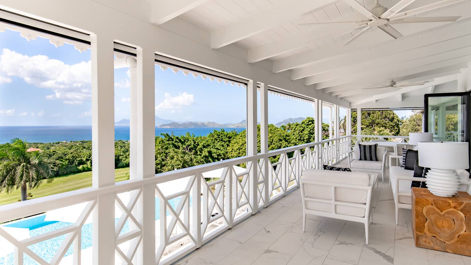 Covered terrace of a private home in Nevis, with pool and sea view