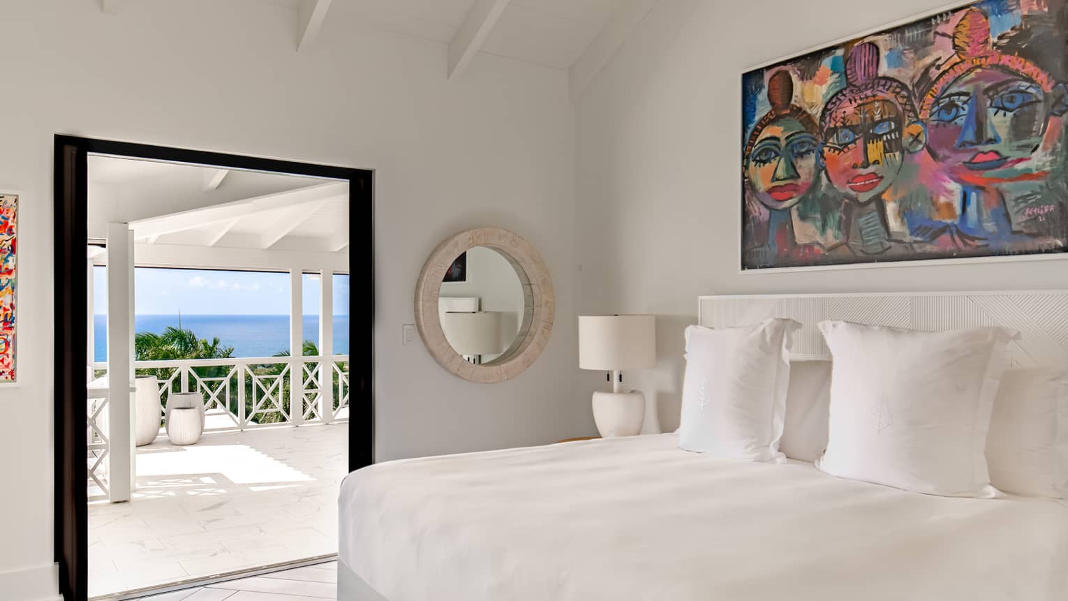 Bedroom with king bed, modern artwork, walk-out sea-view terrace