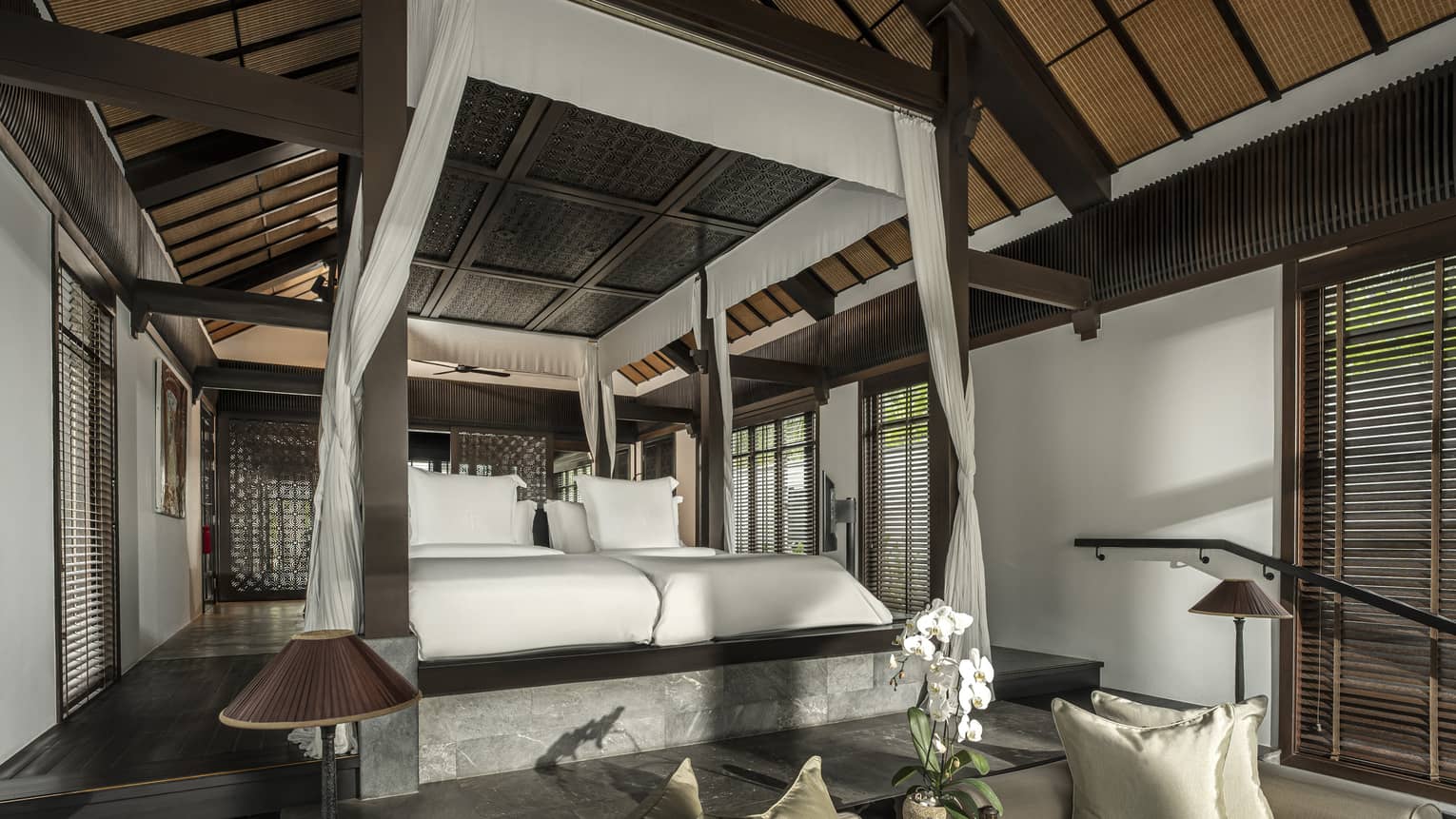 Private Thai villa bedroom with four-poster king bed
