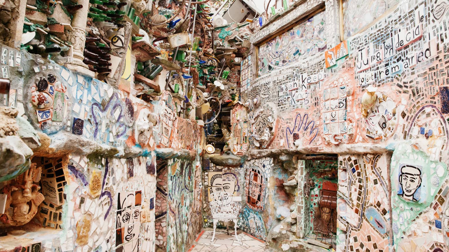 Walls covered in drawings and paintings.