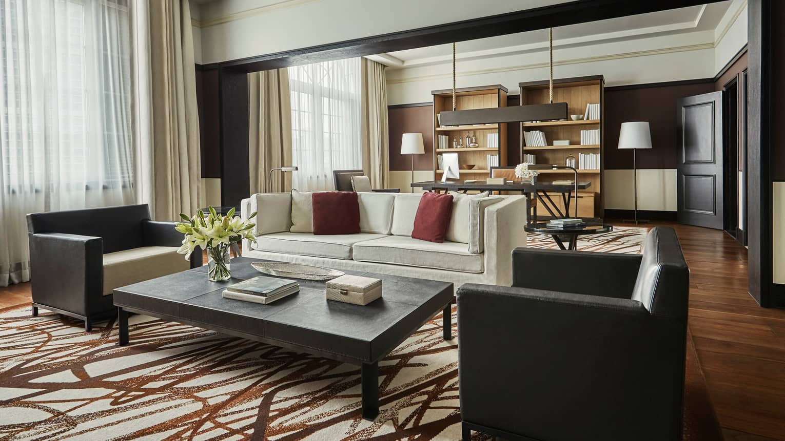 Bright Governor Suite sofa and two armchairs by coffee table, brown-and-white rug