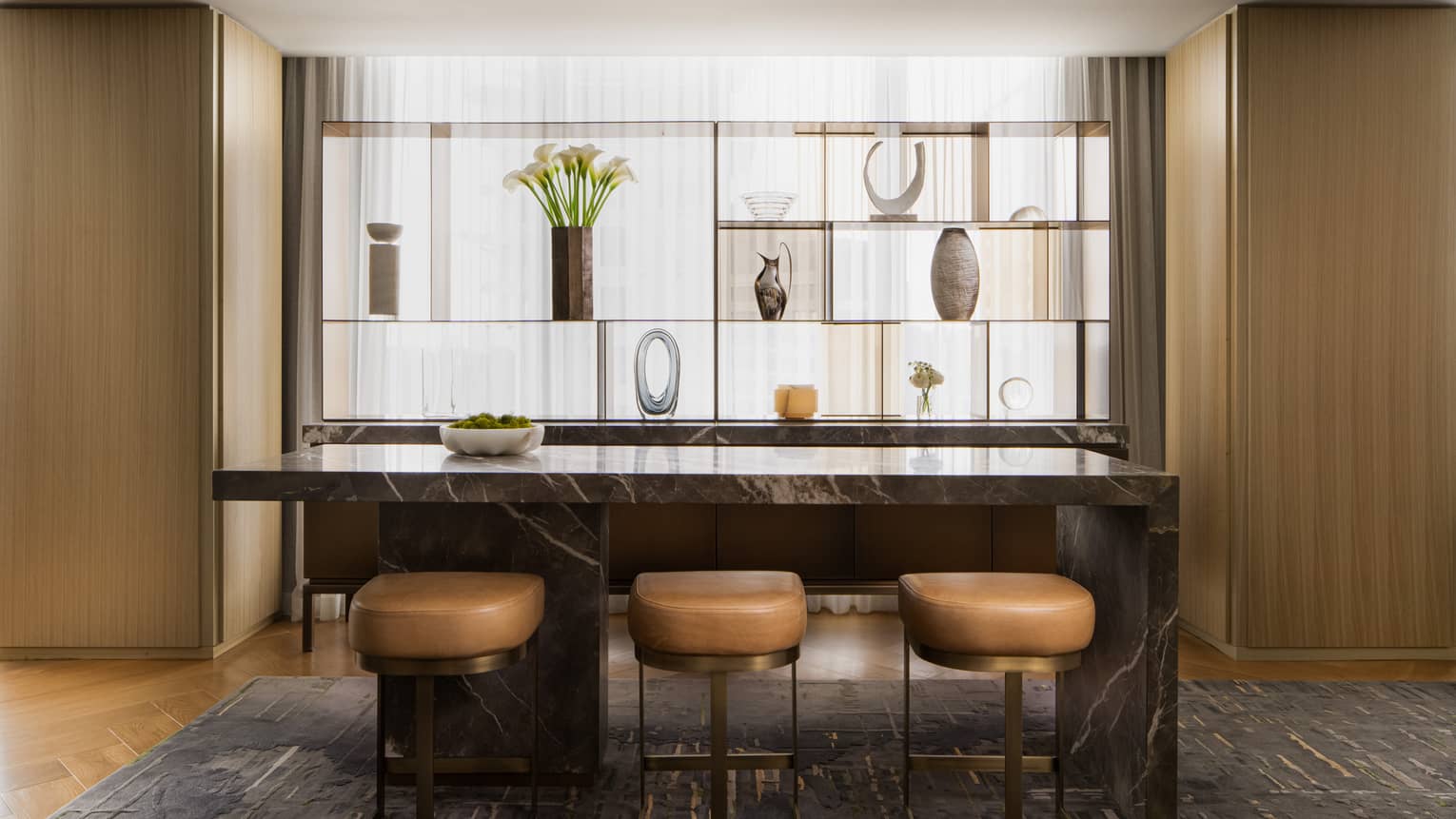 Bar area with three leather stools in luxury suite at Four Seasons Hotel Toronto