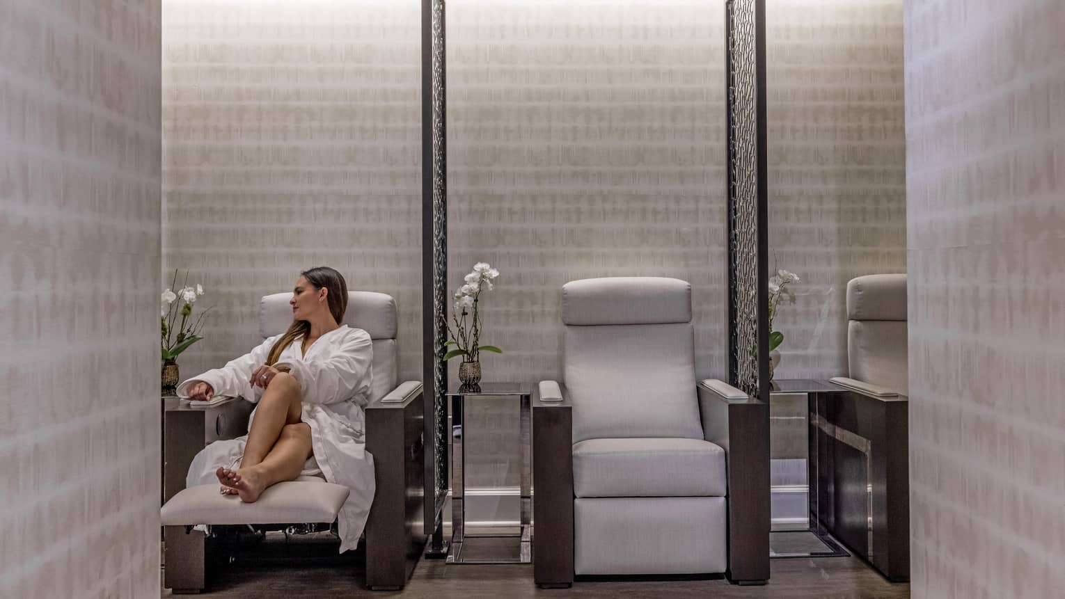 A woman in a chair in a spa.