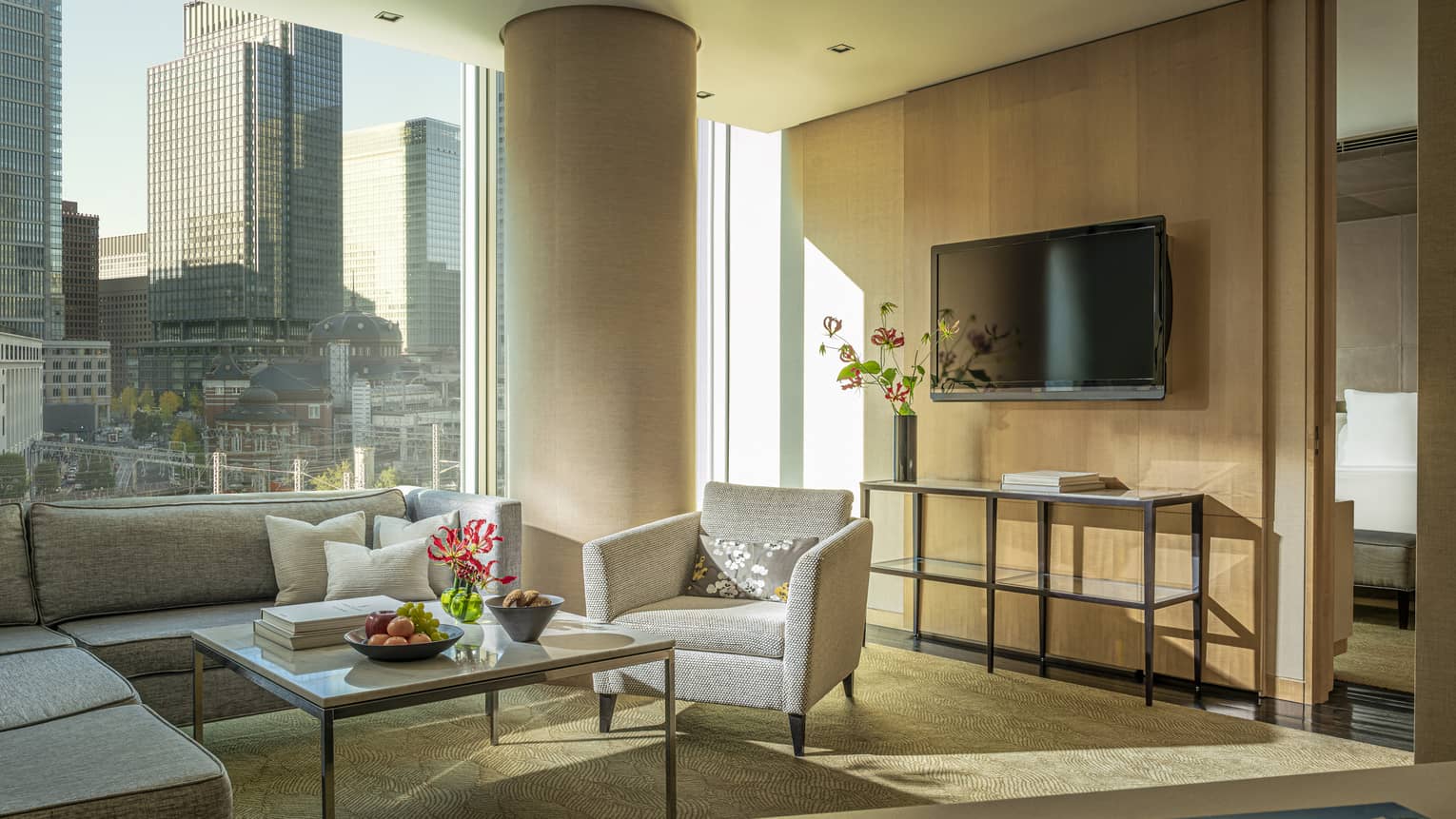 Four Seasons Executive Suite living area with floor-to-ceiling windows with downtown city views