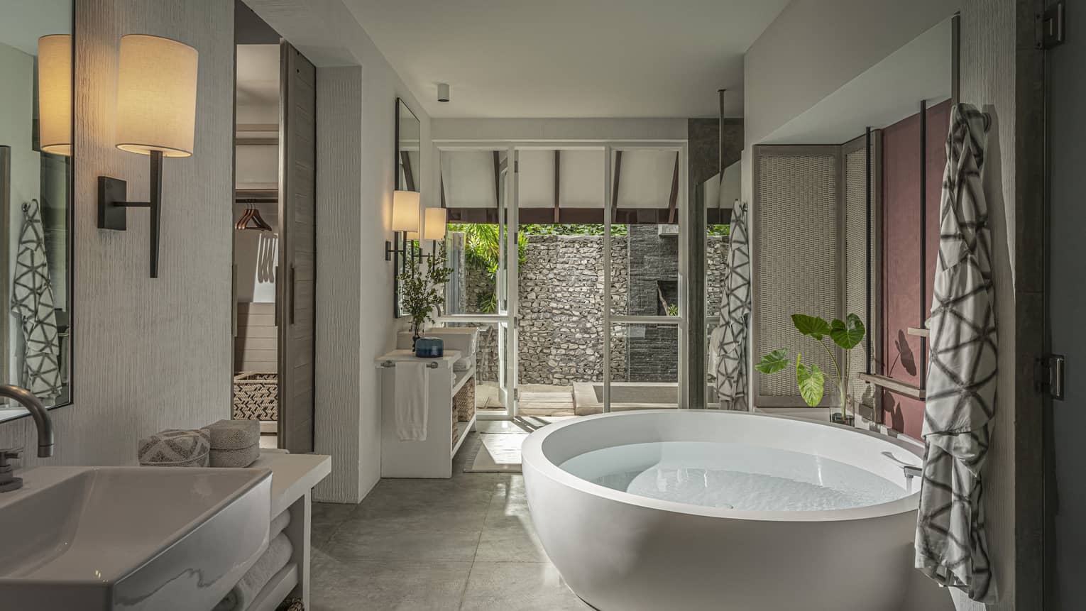 Beach Villa with Pool bathroom with large soaking tub, vanity, door to terrace