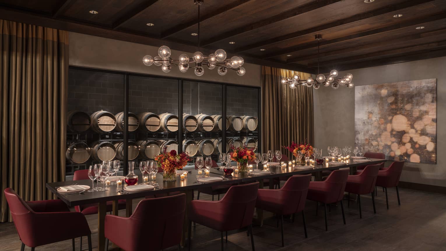 Private dining room, long table with 14 chairs, wooden ceiling, wine barrels