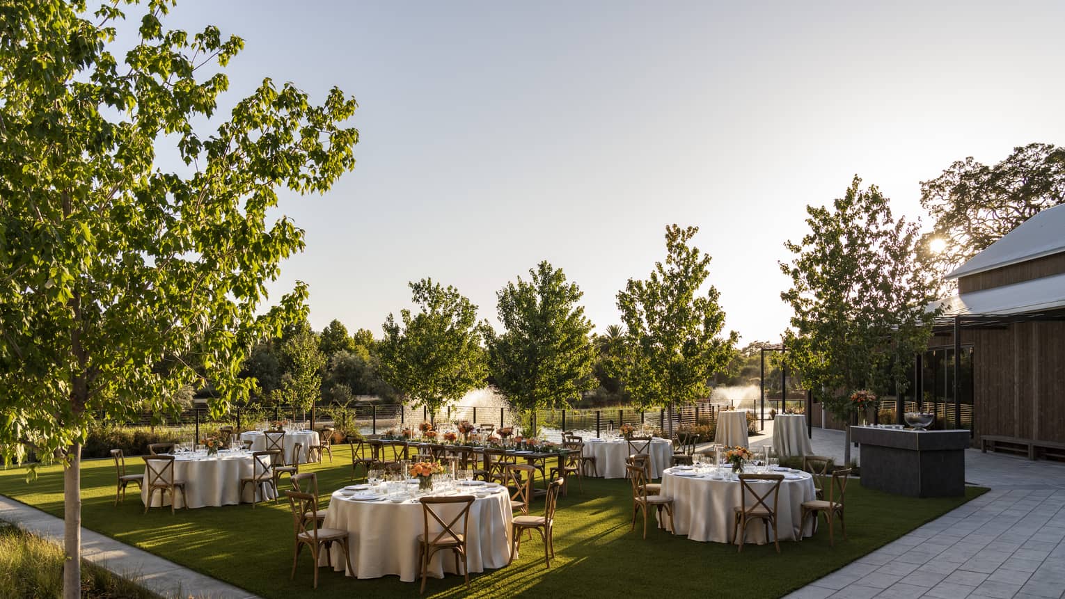 Banquet tables set up in outdoor garden