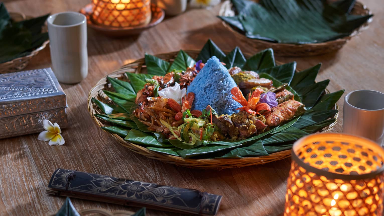 Traditional Balinese cuisine presented on a bed of banana leaves
