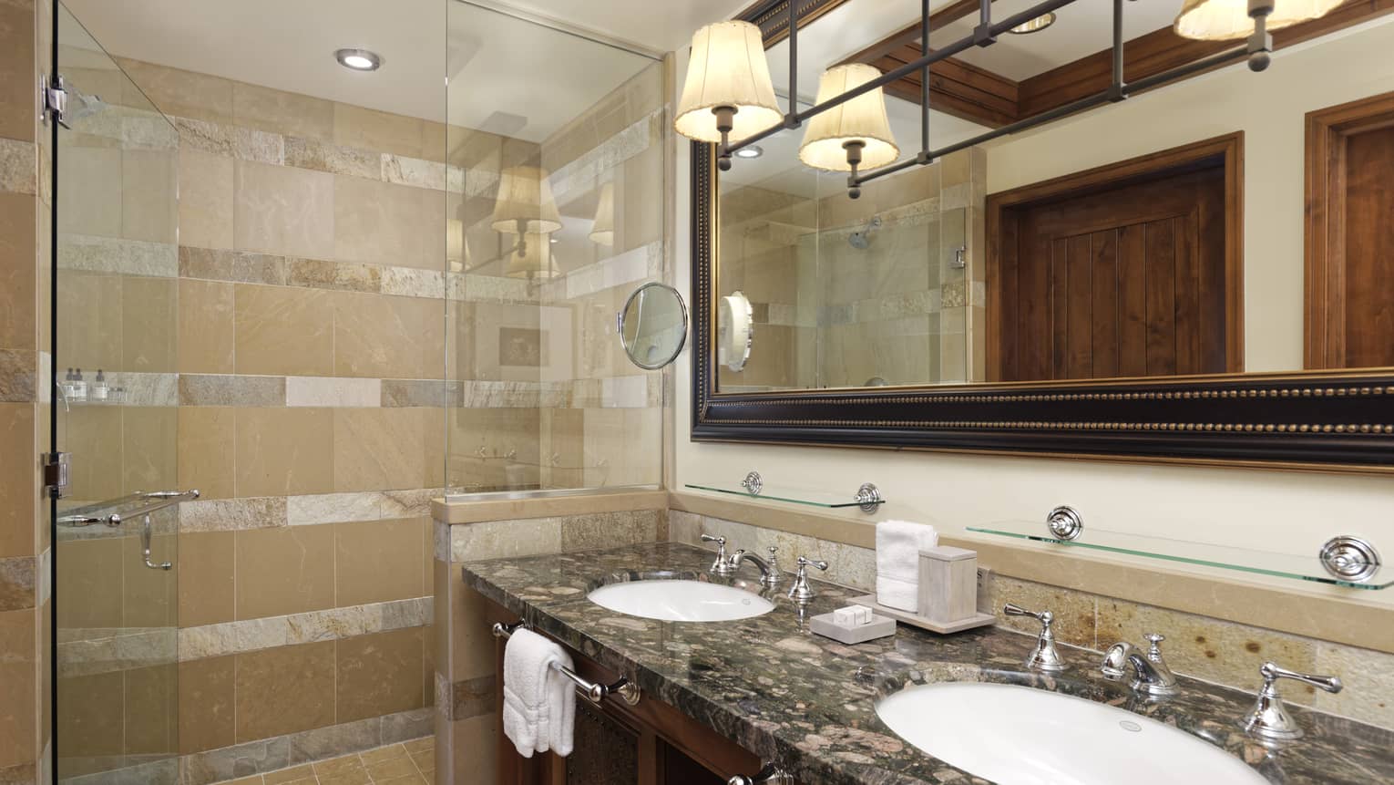 Bathroom with two sinks and walk-in glass shower