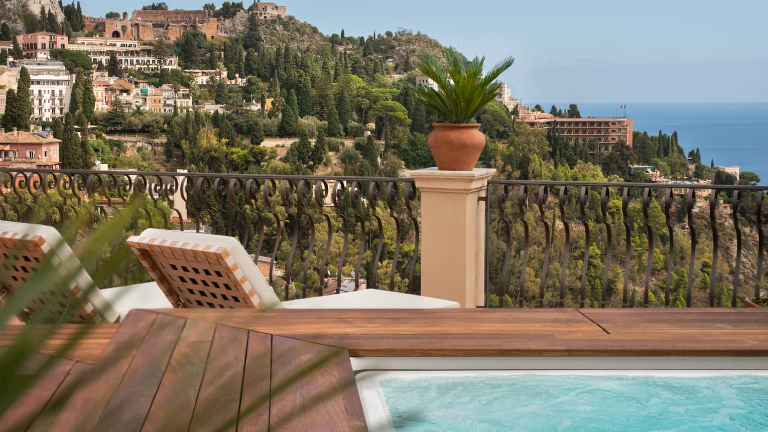 Terrace with hot tub, two lounge chairs, overlooking southern Italian coast