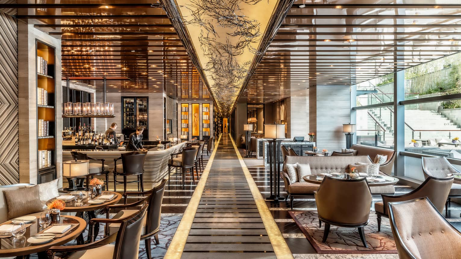 Foo modern dining room with marble, wood grain patterns, illuminated walkway