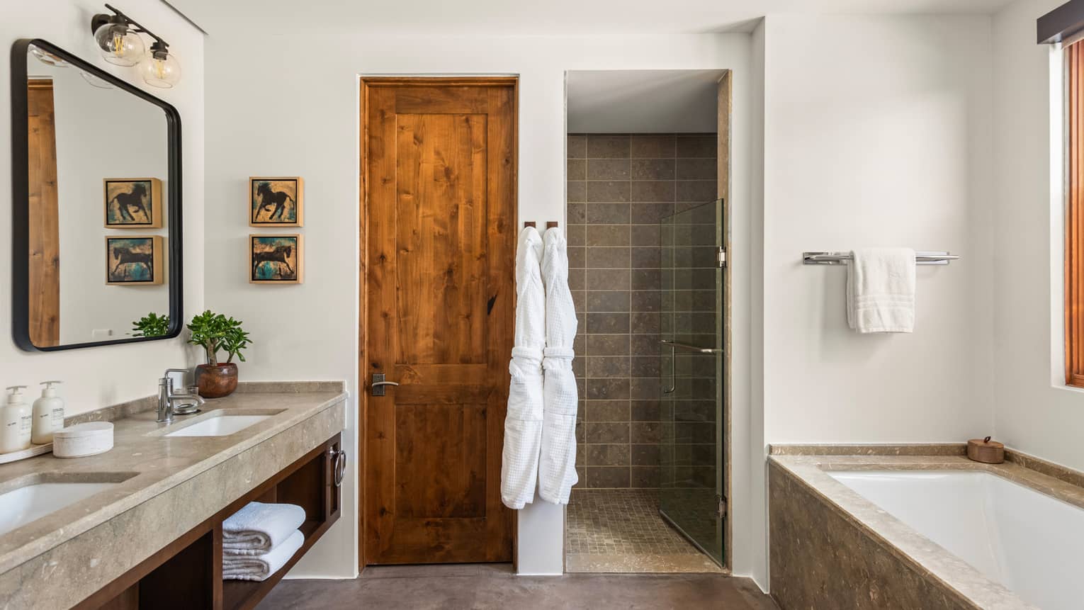 Large hotel bathroom with separate tub and shower at Four Seasons Resort Santa Fe