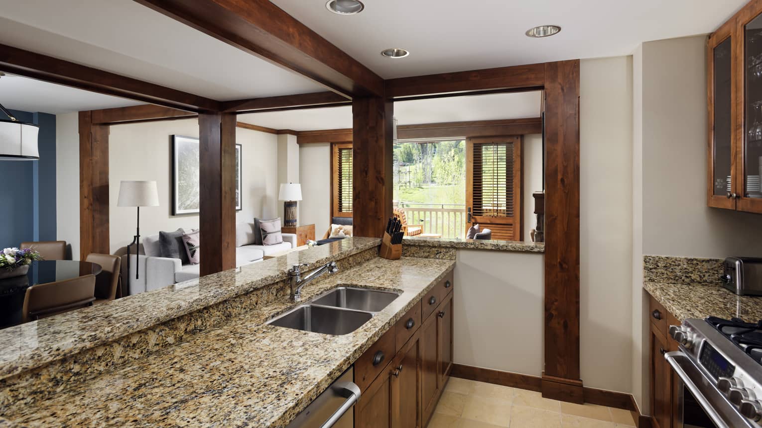 Kitchen with exposed bar counter, granite countertops