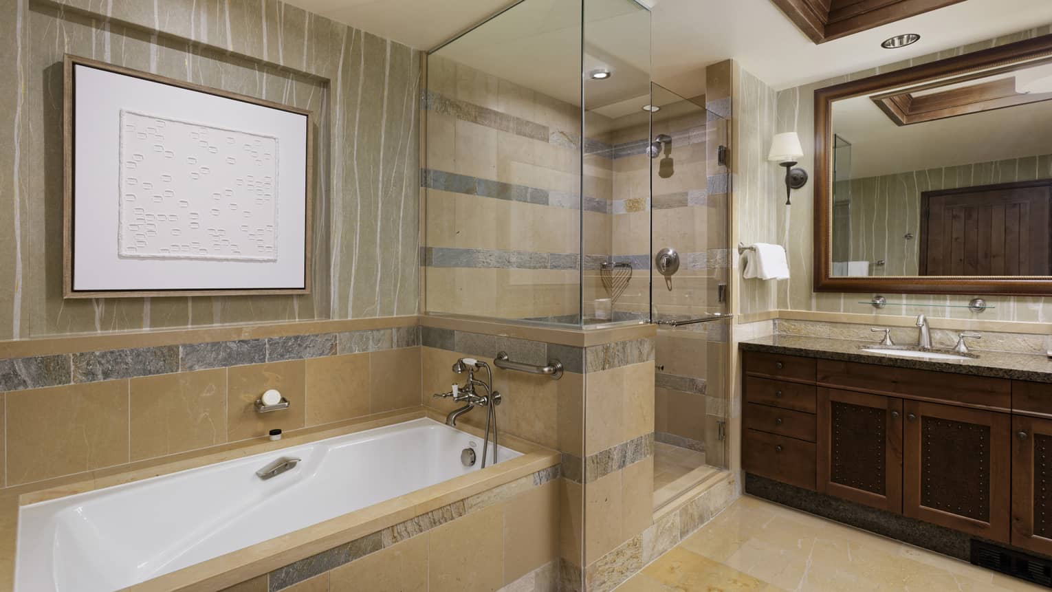 Limestone bathroom with separate shower and tub