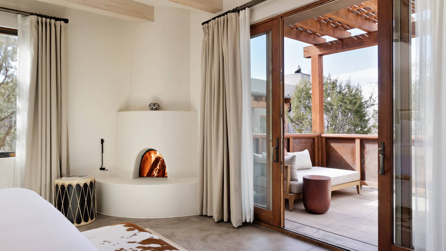 Hotel room with walk-out private terrace with pergola at Four Seasons Resort Santa Fe
