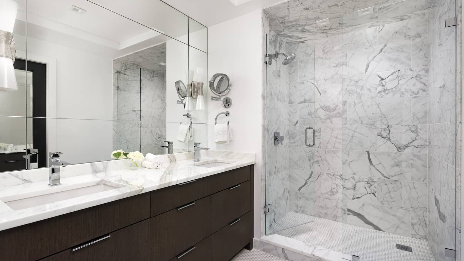 Bathroom with walk-in marble shower, long marble vanity