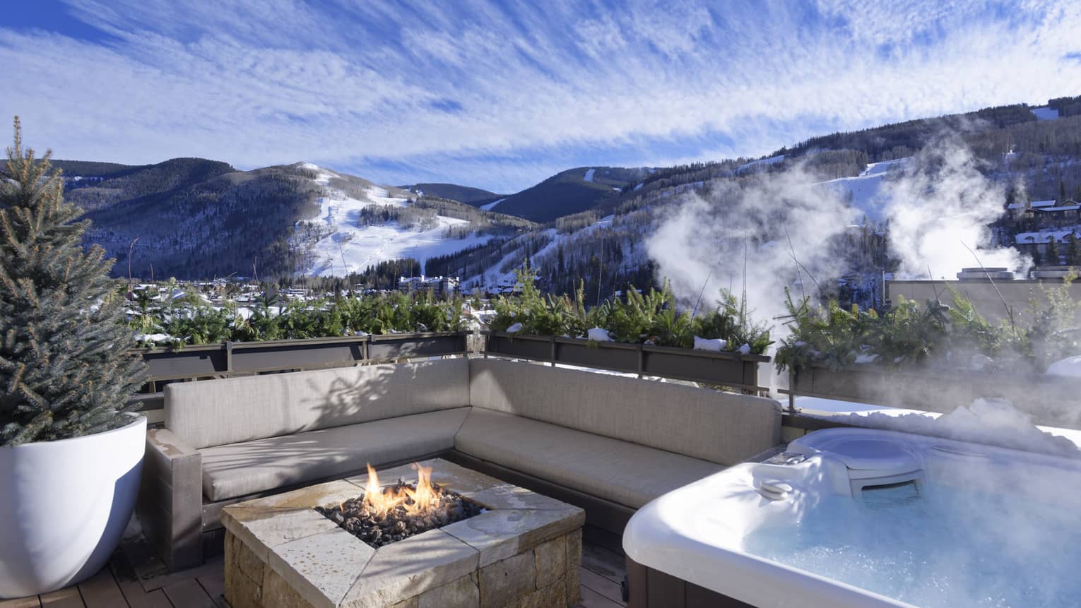 Hot tub and lounge sofa with fireplace