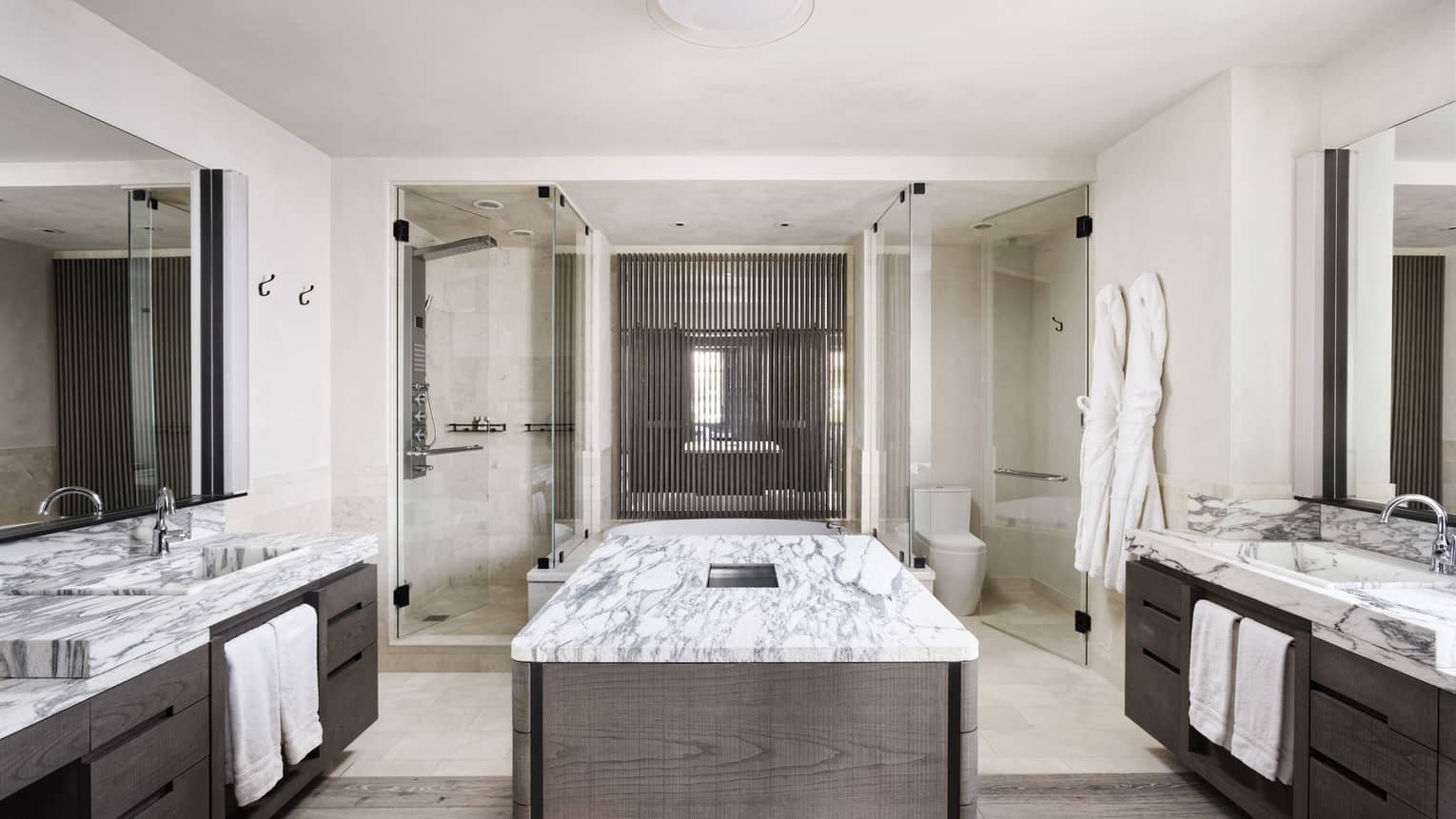 Large bathroom with his and hers double vanities