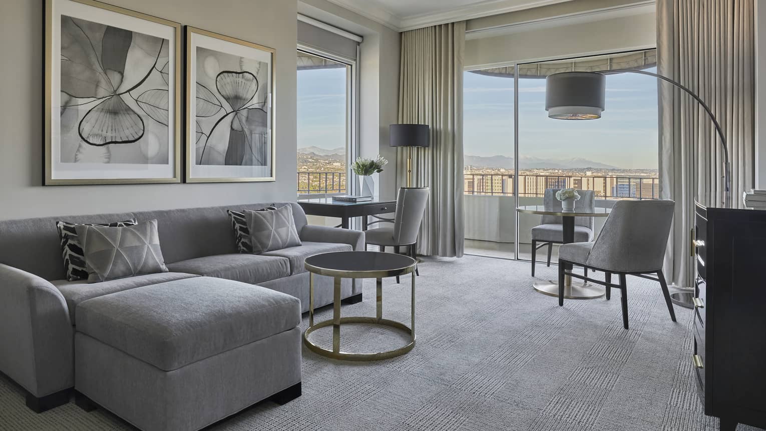 Living room with floor-to-ceiling windows in a Luxury Suite