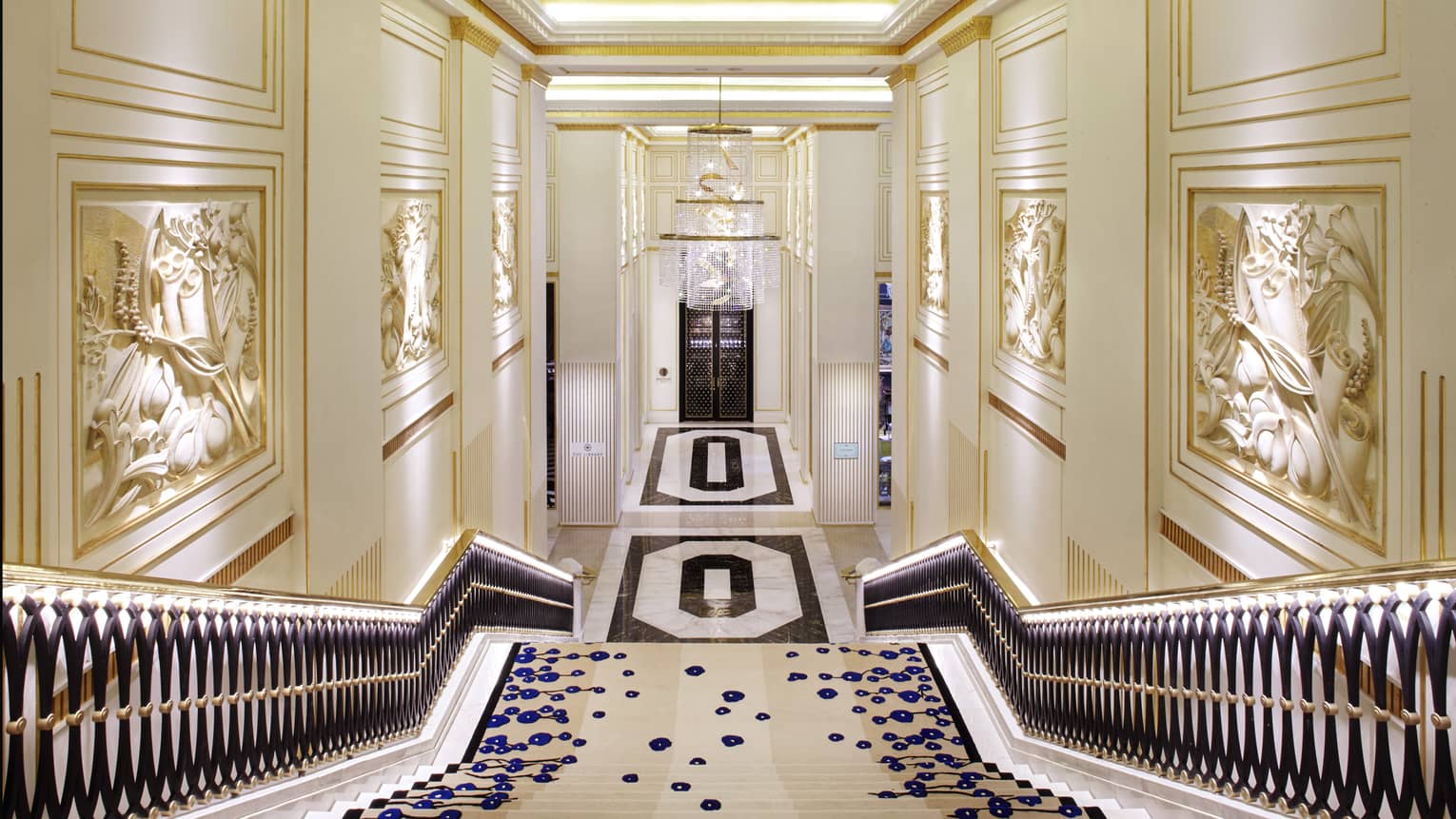 View down marble Grand Staircase to hallway