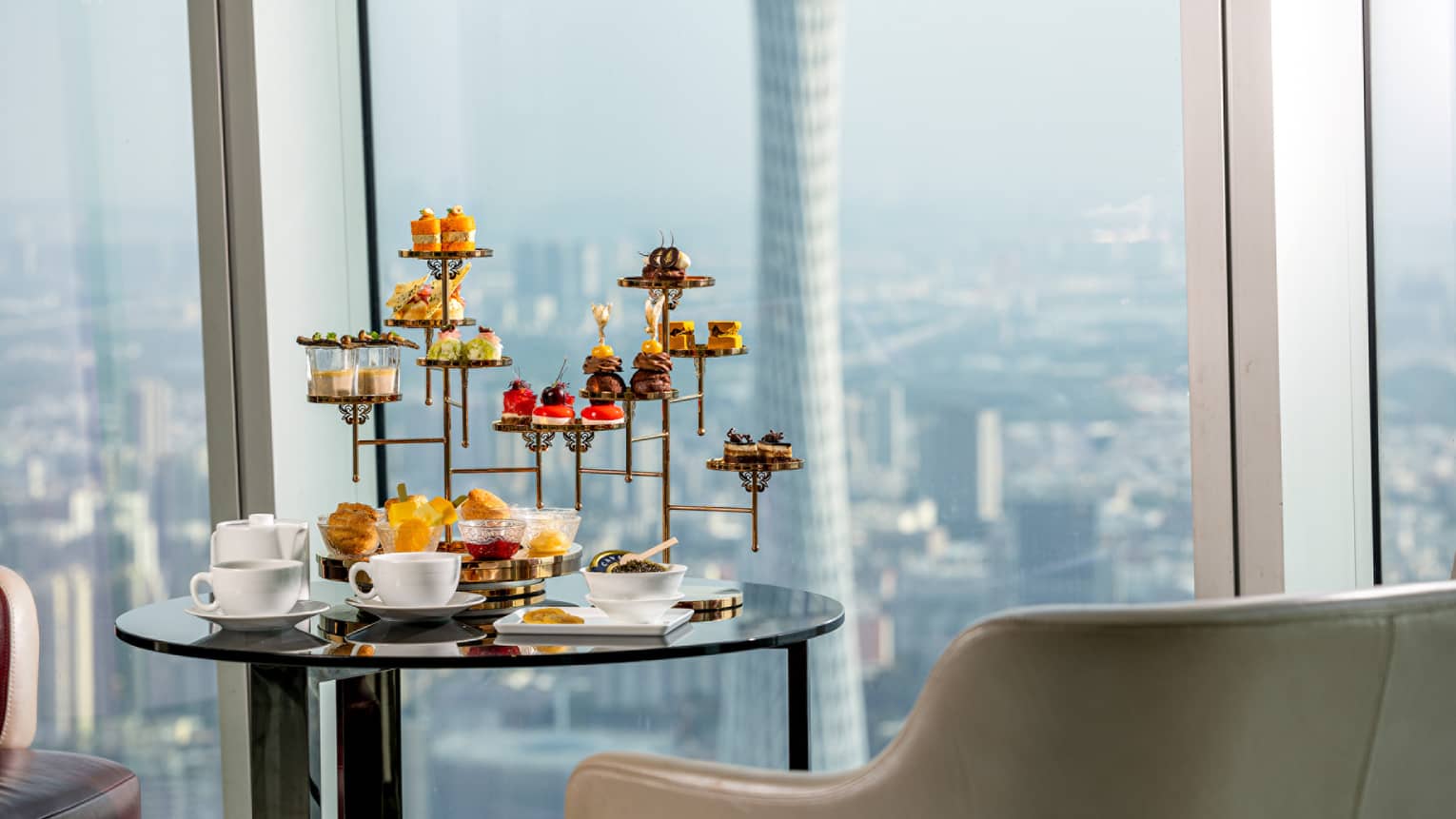 Afternoon Tea sweets tower at the Atrium with views of downtown Guangzhou