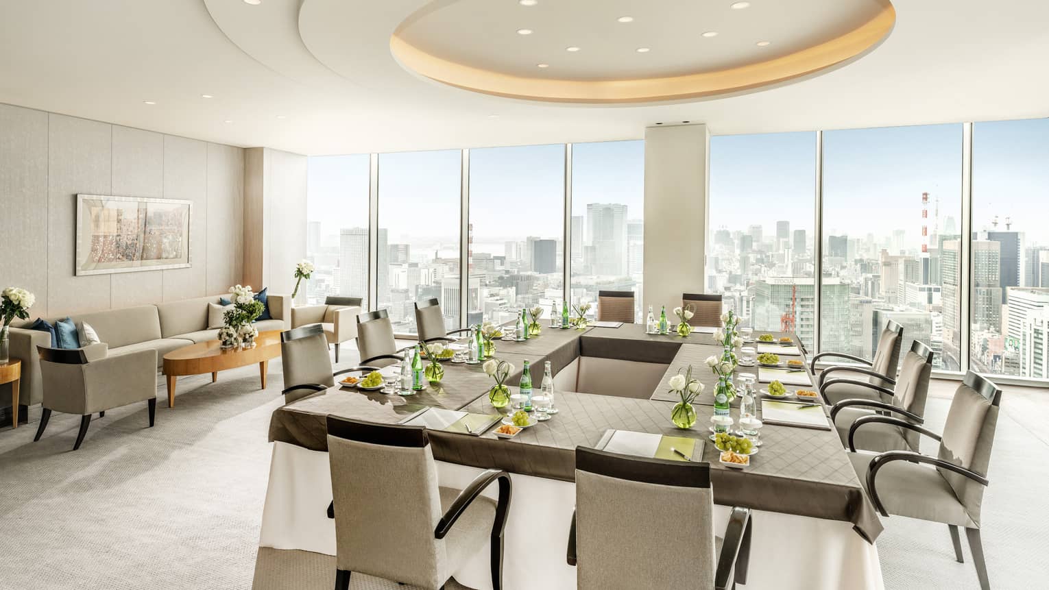 Executive Dining Room with hollow square table, floor-to-ceiling windows with city views