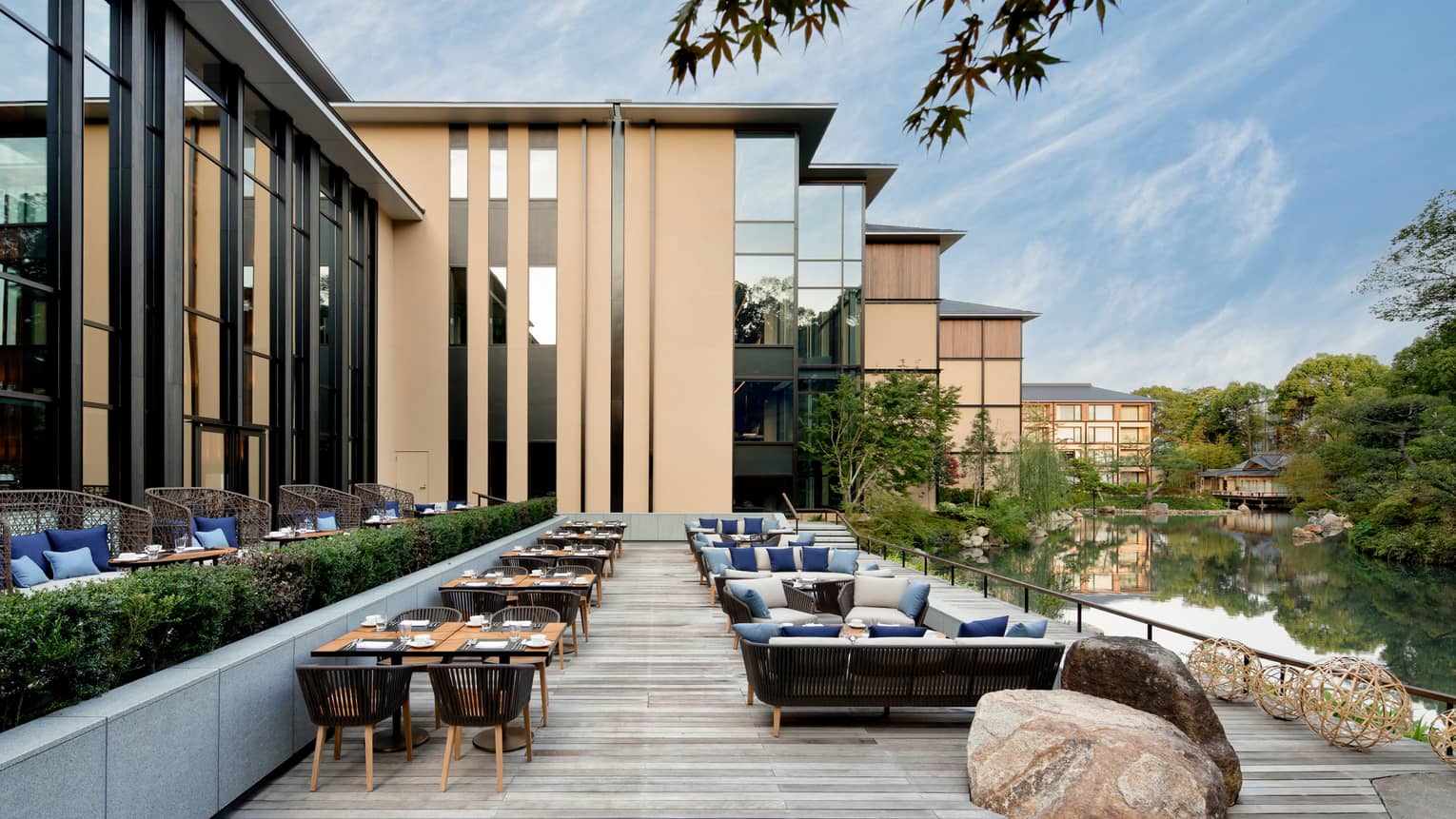 Tables, chairs and large rock on Brasserie Terrace