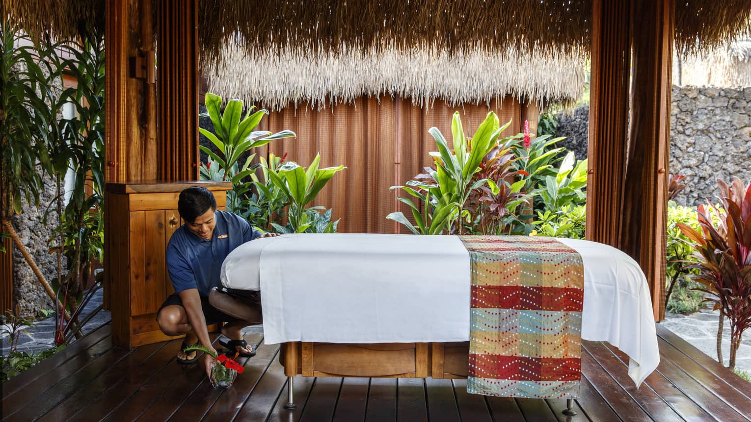 A wellness specialist preparing for a massage