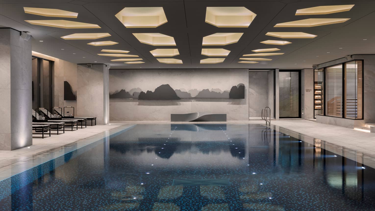 Indoor swimming pool under ceiling with recessed lights