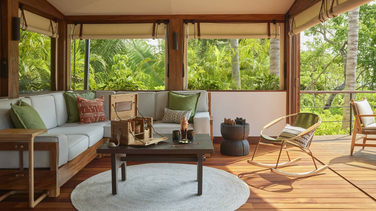 Living room of luxury tent with sofa, coffee table and wooden floors