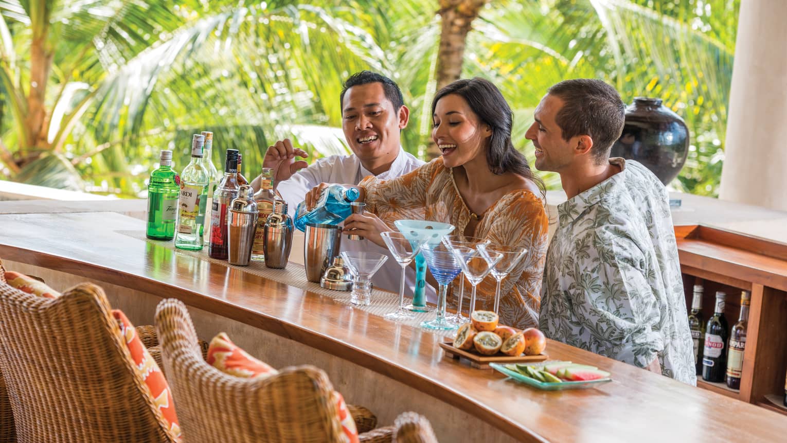 Guests learning how to mix drinks at a cocktail class in Bali
