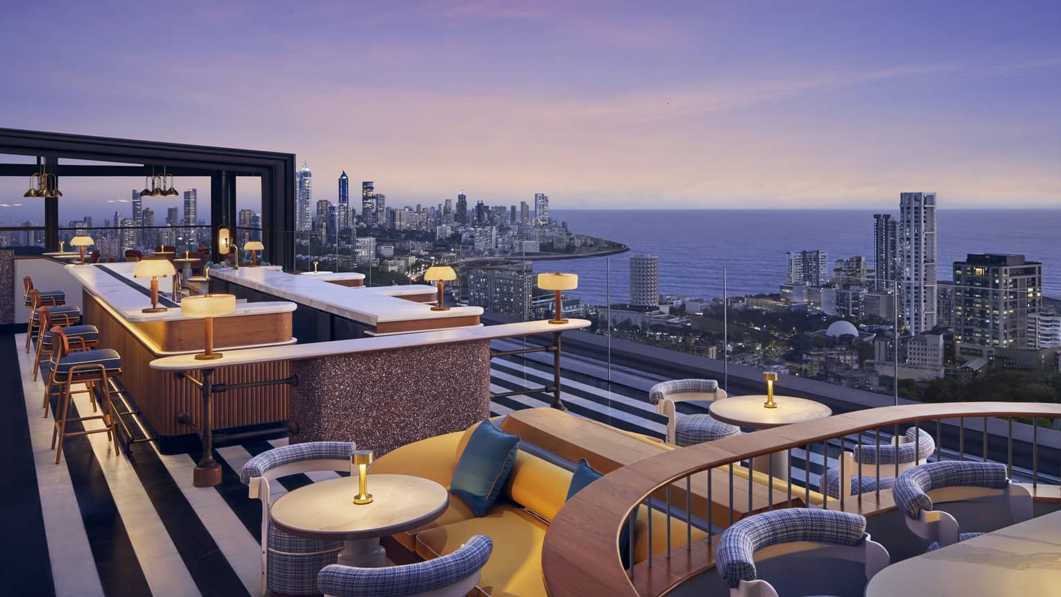 AER rooftop lounge at dusk with views of Mumbai skyline