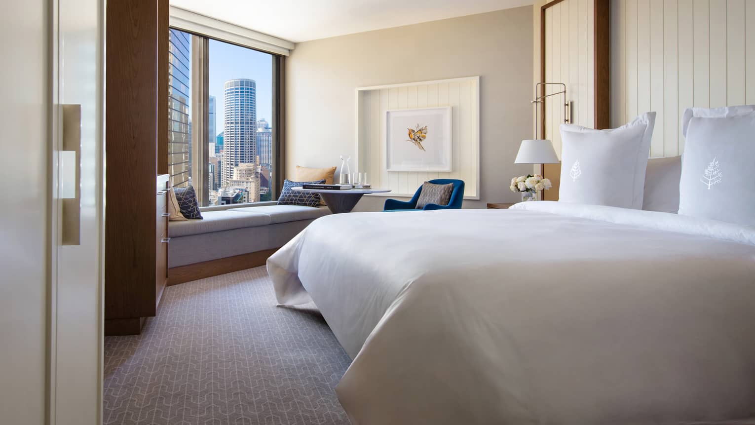 Hotel room with king bed and views of downtown Sydney