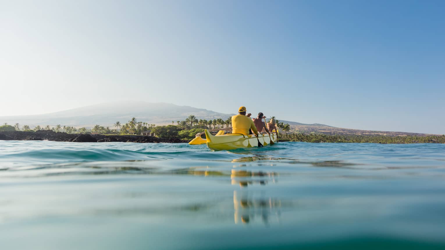 A group of guests take a canoe out on the water