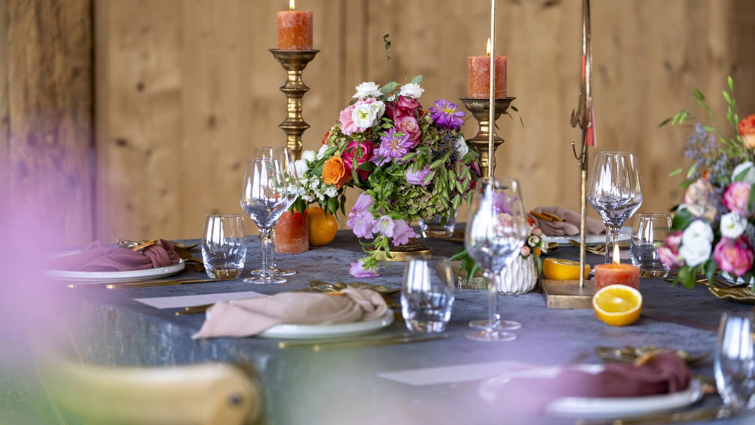 Wedding table setting with assorted flowers and burnished accents