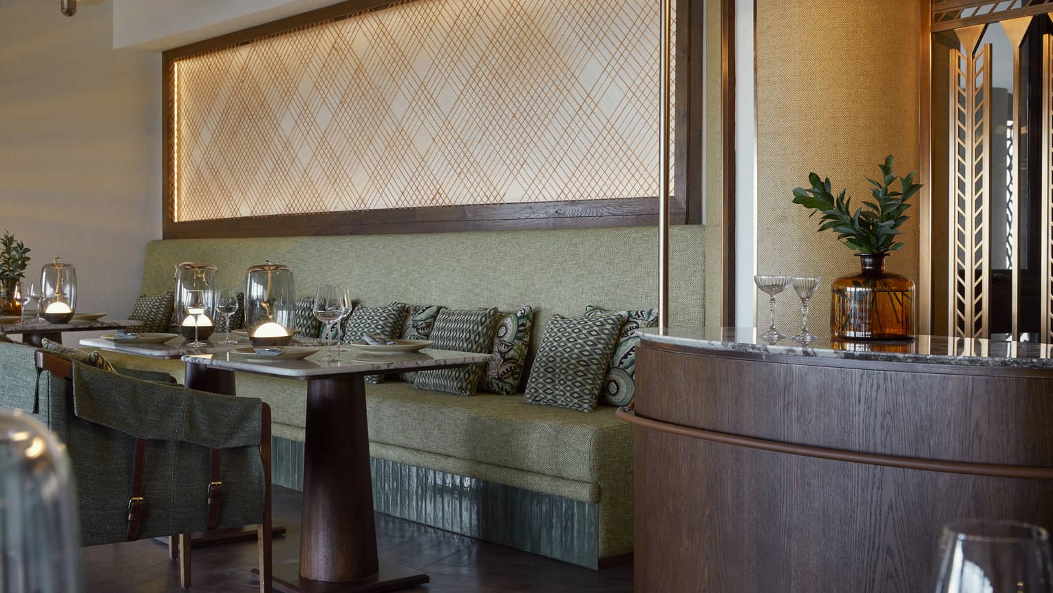 Olive green banquette seating in contemporary restaurant
